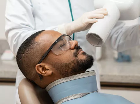 Patient undergoing dental x-ray