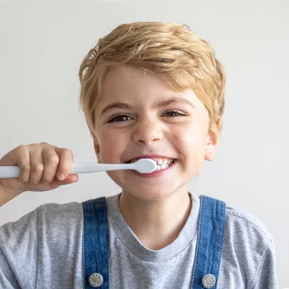 Young boy brushing his teeth